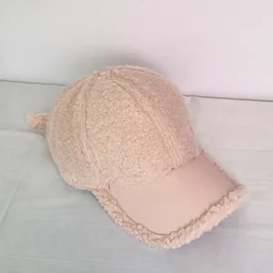Top view of plush lamb wool baseball cap with leather brim and side ear details