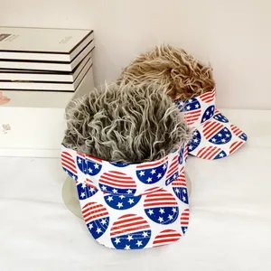 Detail view of two sun visors with synthetic hair featuring US flag star and stripe patterns