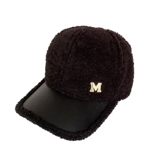 Winter faux fur baseball cap with leather brim and rhinestone M logo for women