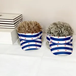 Detail of USA flag sun visors with attached brown and gray synthetic wig hair accents