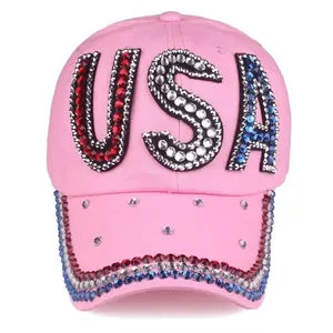 Close-up of pink denim baseball cap with USA rhinestones and sparkling brim details