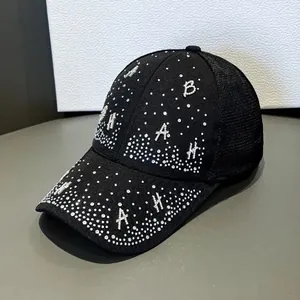 Detail shot of black mesh baseball cap with silver rhinestones and BAH letter patches
