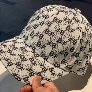 White monogram baseball cap with sparkling rhinestones and black BF print