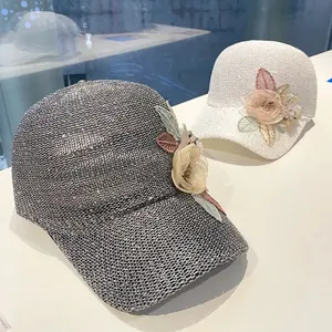 Detailed view of floral mesh baseball cap with 3D organza flower and leaf embellishments