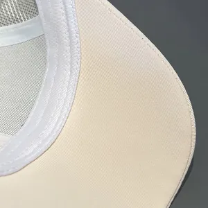 Detail of off-white twill fabric and premium stitching on a breathable mesh baseball cap