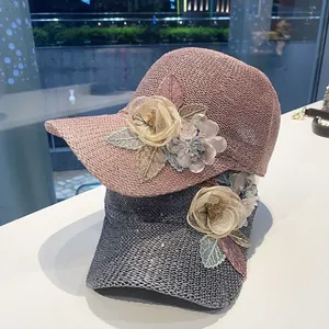 Women's knit lace baseball cap with sequins and floral detail in pink and grey
