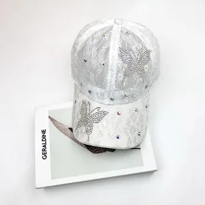 White lace baseball cap featuring rhinestone butterfly decorations and a breathable mesh design