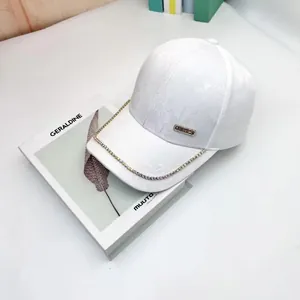 White baseball cap with rose texture, colorful rhinestones and silver metal plaque