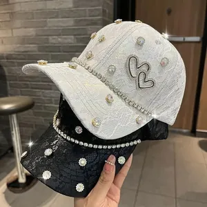Detail of lace floral pattern and sparkling rhinestones on sweet fashion baseball cap