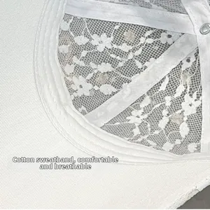 Detail of white lace baseball cap featuring cotton sweatband and breathable mesh fabric