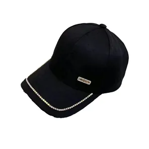 Black velvet baseball cap featuring rose gold metal plate and colorful rhinestones on brim