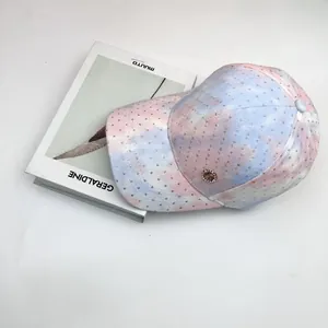 Pink and blue tie-dye baseball cap with sparkling rhinestones and metal H logo