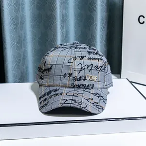 Street style baseball cap with grey plaid pattern and rhinestone CORE logo detailing