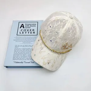 Elegant ivory lace baseball cap for women with rhinestone chain and crystal bow detail