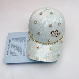 Light green lace baseball cap with sparkling rhinestones and double heart logo