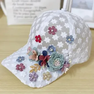 Macro detail of handmade 3D fabric flowers and rhinestones on lace baseball cap
