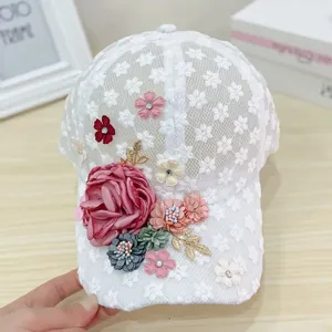 Detailed close-up of handmade floral lace mesh baseball cap with 3D fabric flowers
