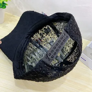 Detail of adjustable snapback buckle on black floral lace mesh sun baseball cap