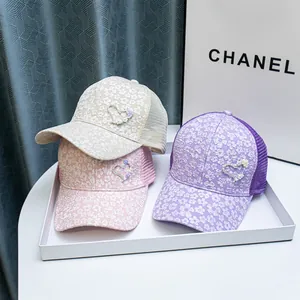 Lace floral baseball cap with rhinestone heart and breathable mesh in beige, pink, and purple