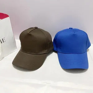 Classic five-panel baseball caps in dark brown and royal blue with premium copper buckle