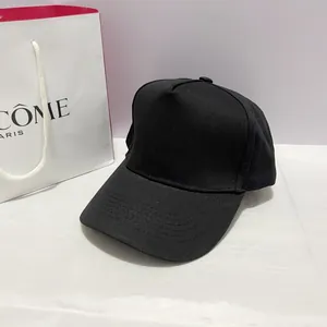 Detail of a classic black five-panel baseball cap made of premium cotton twill fabric