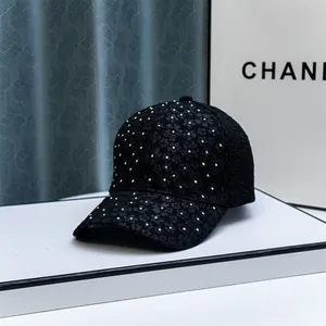 Fashionable black baseball cap featuring 3D floral textures and sparkling colorful rhinestones