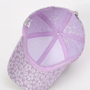 Detail of floral baseball cap interior with 100% polyester wash label and reinforced seams