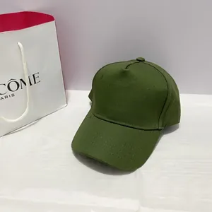 Detail view of army green cotton five-panel baseball cap with curved brim and top button