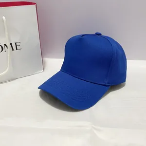 Detailed side view of a royal blue five-panel structured baseball cap in twill fabric