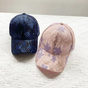 Women's summer floral lace baseball cap in navy blue and pink with breathable mesh design