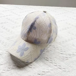 Detail of floral lace mesh and breathable fabric on summer sun protection baseball cap