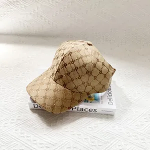 Detailed close-up of vintage jacquard fabric with rhinestone R-letter and sequins on cap