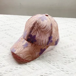 Detail of floral lace embroidery on breathable baseball cap with floral 3D patterns