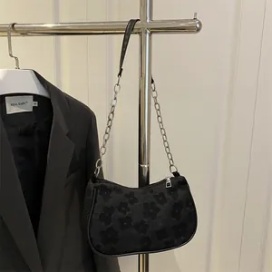 Chic black floral jacquard underarm bag with silver chain strap for minimalist styling