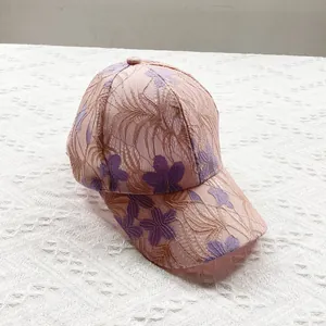Detail of floral lace embroidery and breathable fabric on this pink sun baseball cap