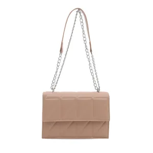 Quilted pink crossbody bag with diamond patterns and silver chain strap for women