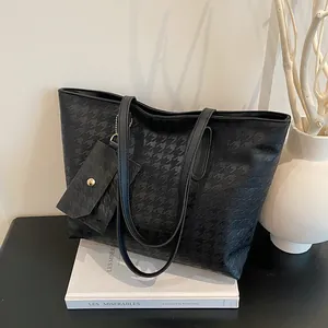Classic black houndstooth tote bag with matching small coin purse for daily commute