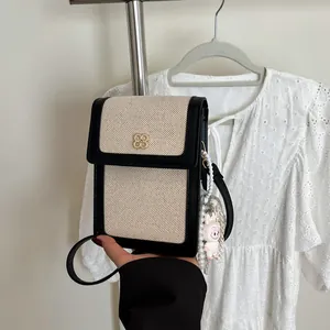 Mini sac bandoulière en toile avec bordure contrastée et poignée en perles