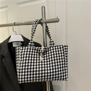 Classic black and white gingham canvas tote bag with wooden horn button closure and dual handles