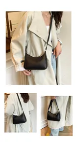 Detailed views of a black pebbled leather underarm bag with top zipper and slim shoulder strap