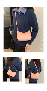 Pink crescent moon crossbody bag showing front and side views on model outfit
