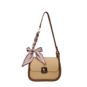 Minimalist minimalist crossbody shoulder bag in beige with brown trim and silk scarf