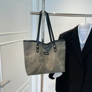 Fashionable dark grey large tote bag with marble texture and slim black straps