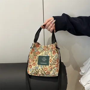 Retro floral jacquard bucket bag with large capacity and adjustable crossbody strap