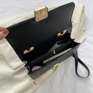 Quilted black crossbody bag with gold hardware and spacious interior compartments