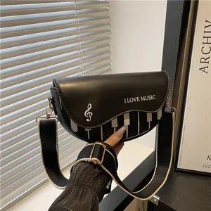 Sac bandoulière rétro motif piano avec notes de musique et sangle rayée ajustable