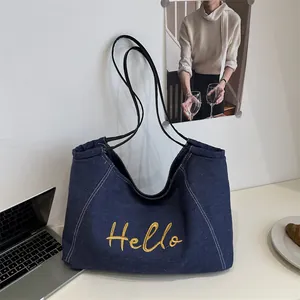 Sac fourre-tout en denim bleu marine avec broderie Hello jaune et bandoulière longue