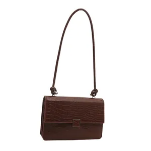 Deep brown crocodile embossed rectangular shoulder bag with vintage flap and strap