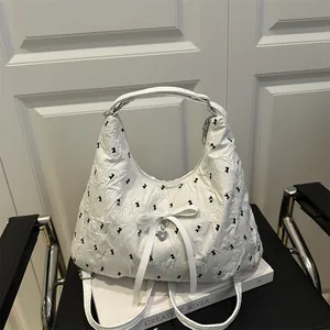 Chic pleated white tote bag with black bow patterns and silver heart pendant
