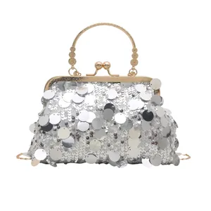 Elegant silver sequin evening clutch with golden floral handle and chain strap for women
